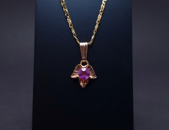 Vintage gold pendant with colored stone