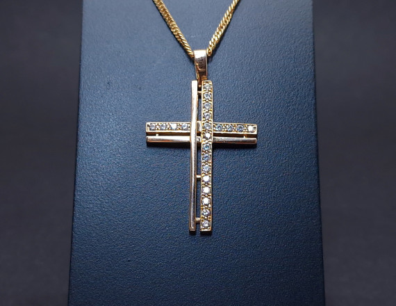 Gold cross with zircons