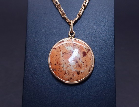 Vintage gold pendant with colored stone