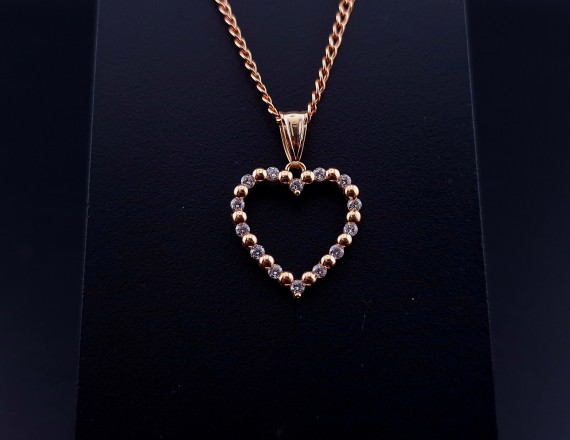 Gold pendant with zircons