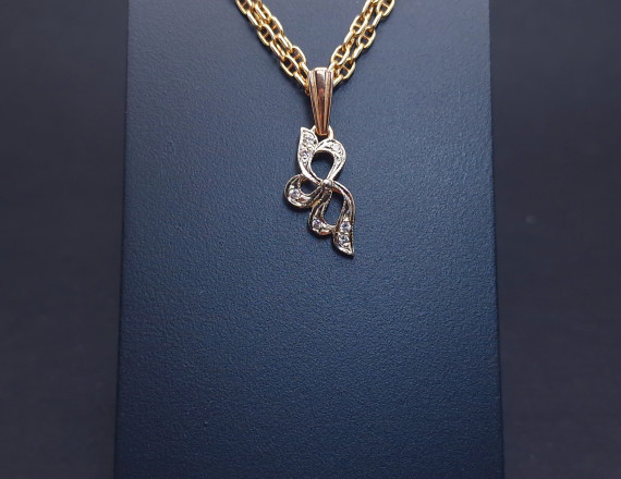 Gold pendant with zircons