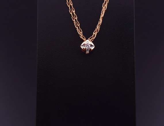 Gold pendant with zircon