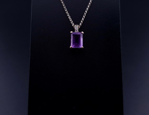 Gold pendant with colored stones