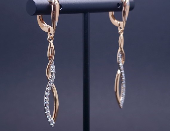 Gold earrings with zircons 