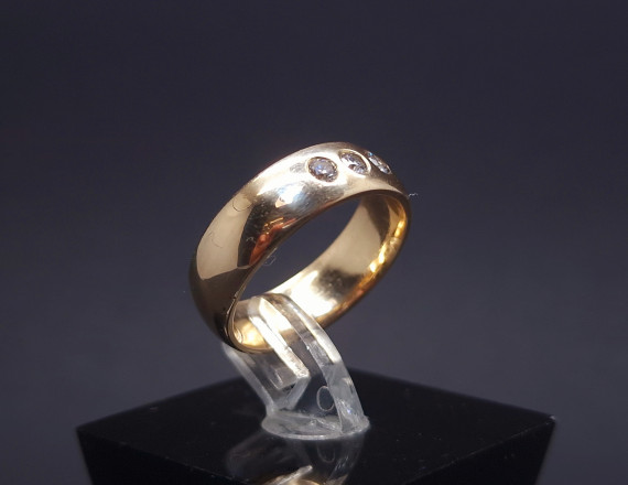 Gold wedding ring with diamonds