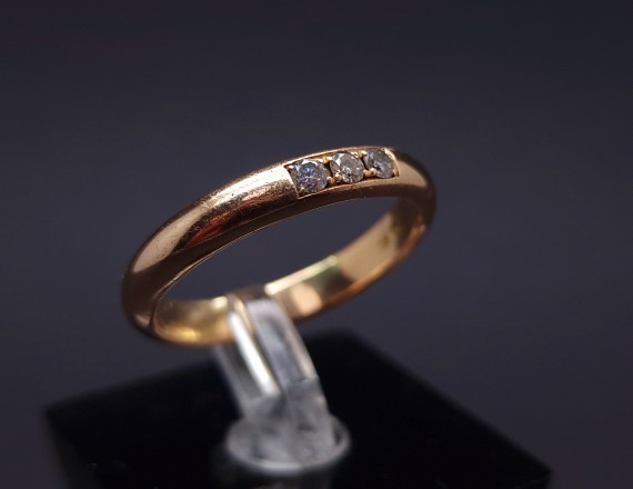 Gold wedding ring with diamonds