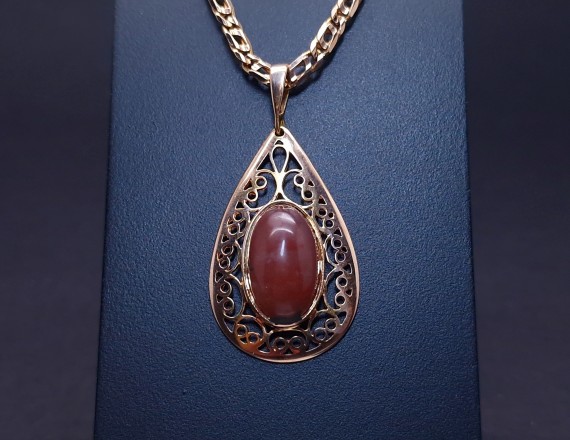 Vintage gold pendant with colored stone