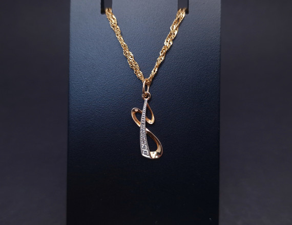 Gold pendant with zircons