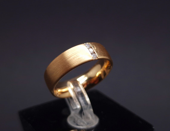 Gold wedding ring with diamonds