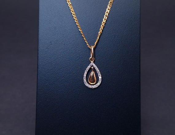 Gold pendant with zircons